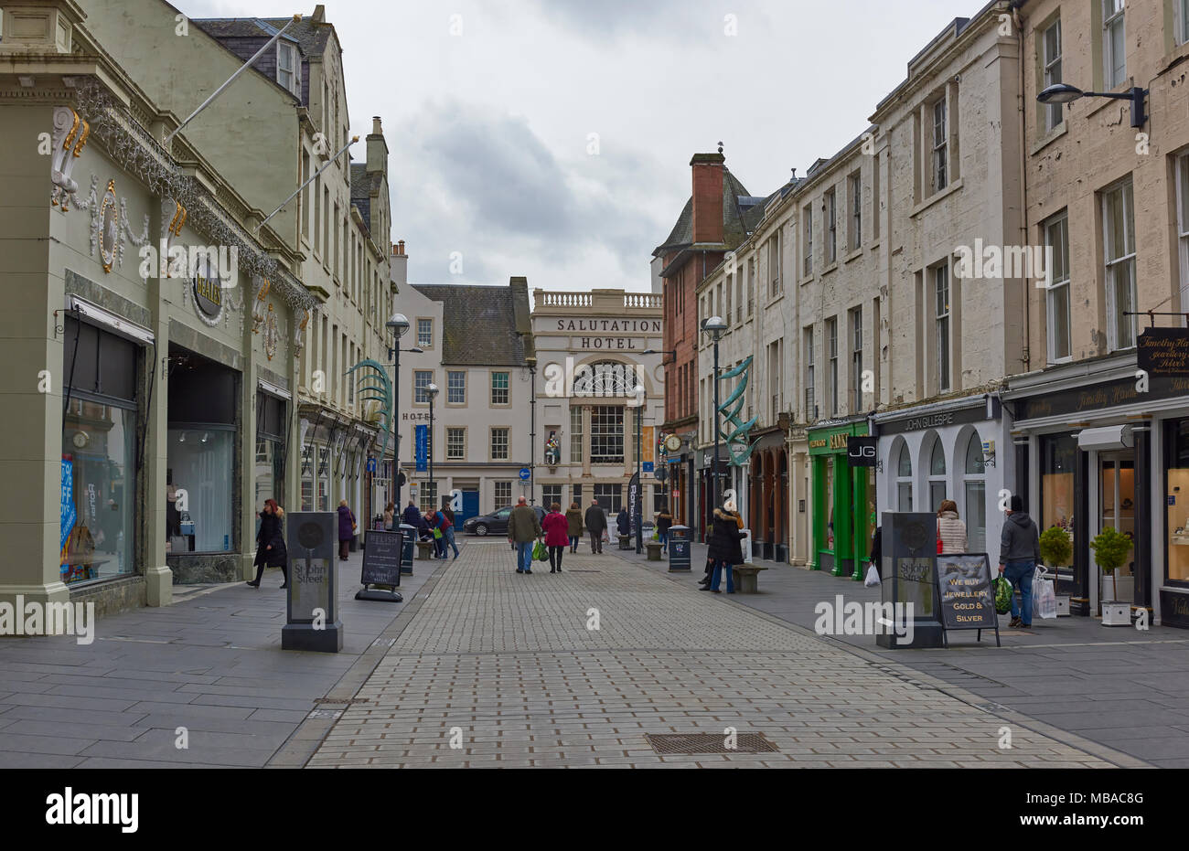 People walking through St John Street and all its Shops on one Saturday afternoon in Spring, in Perth, Perthshire, Scotland. Stock Photo