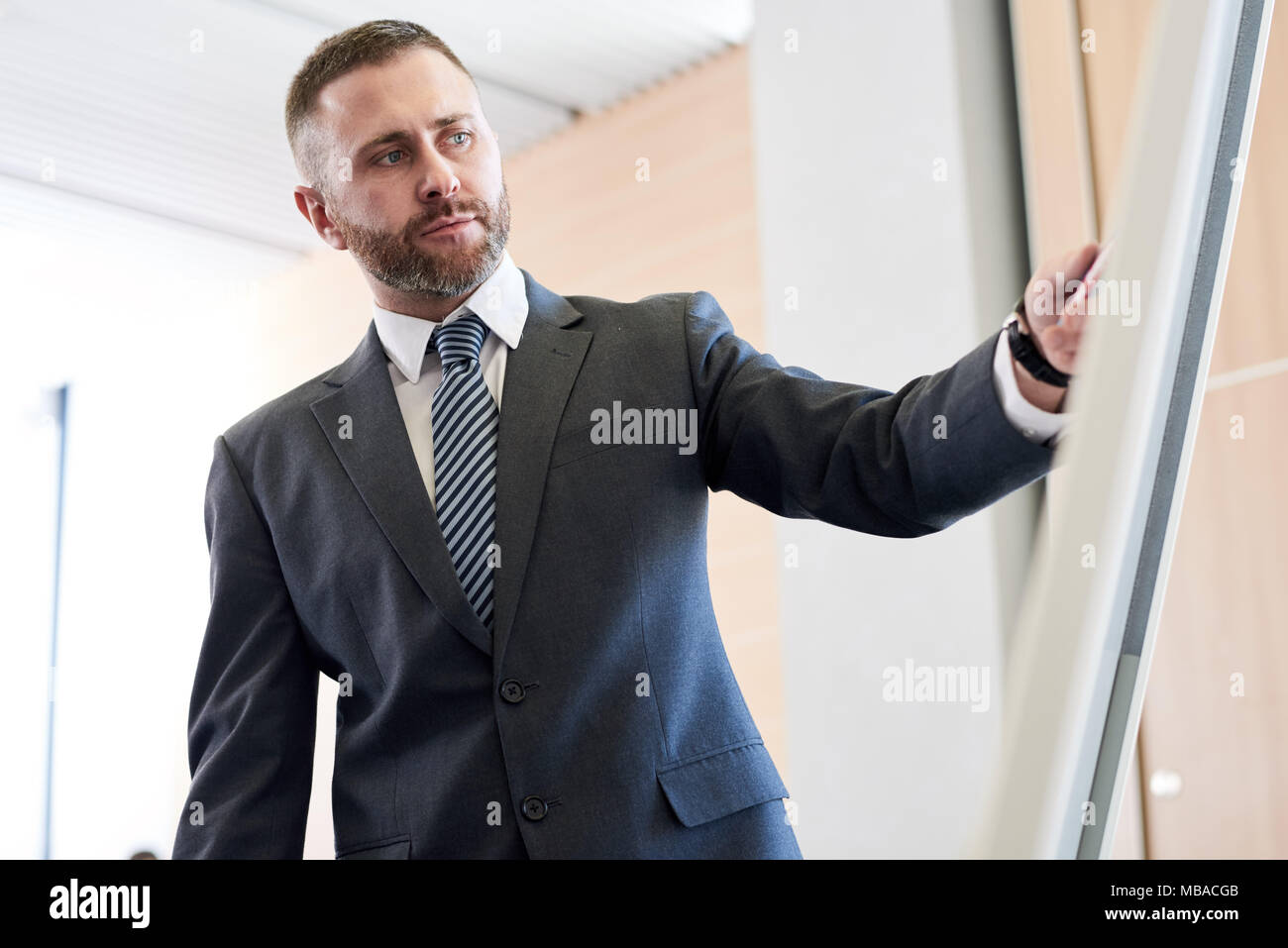 Successful Businessman at Whiteboard Stock Photo