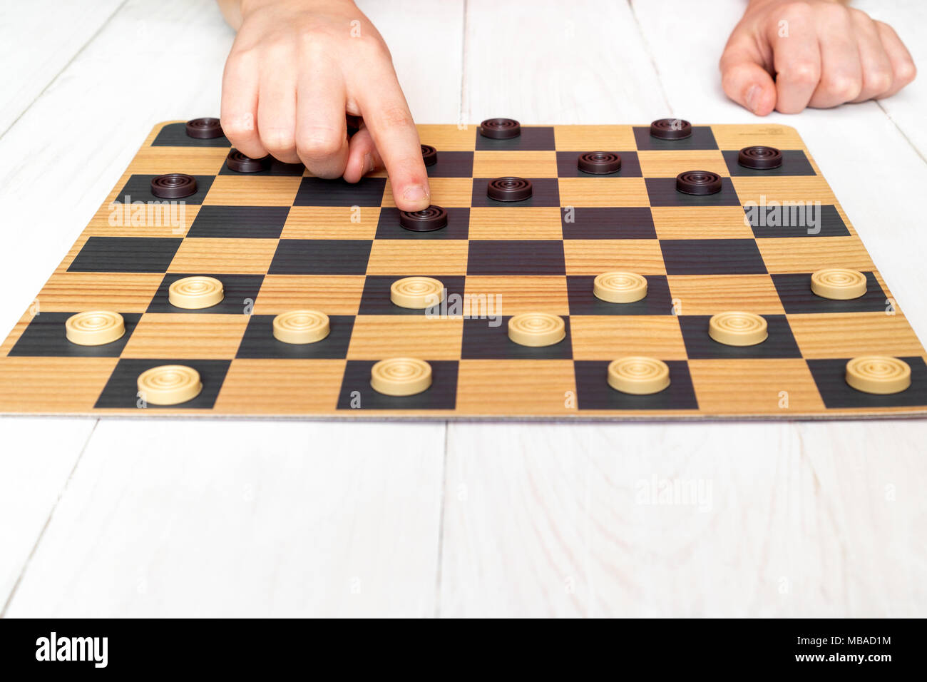 Child playing checkers board game.Game education lifestyle concept ...