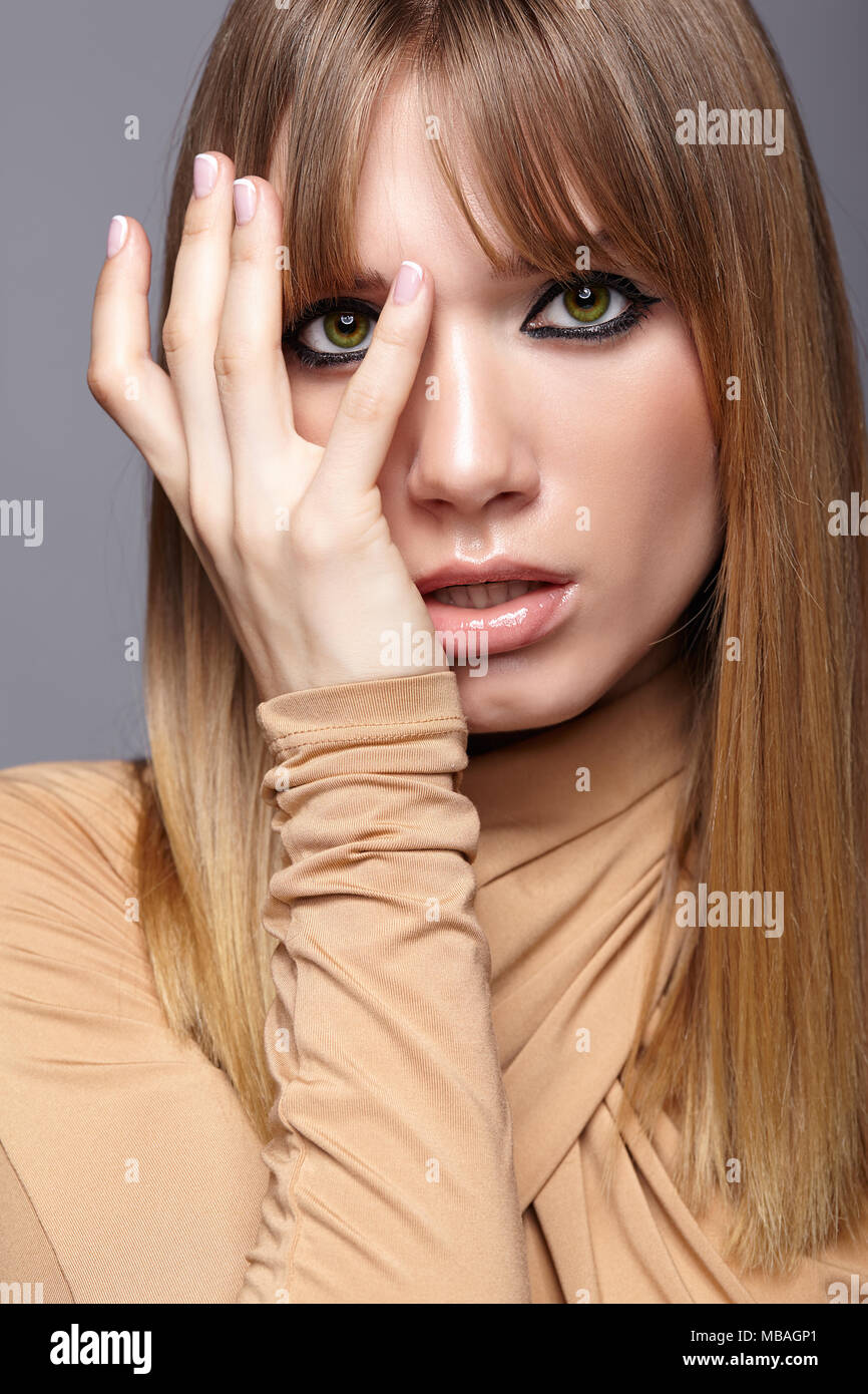 Portrait of blonde young woman. Female with green eyes and long ...