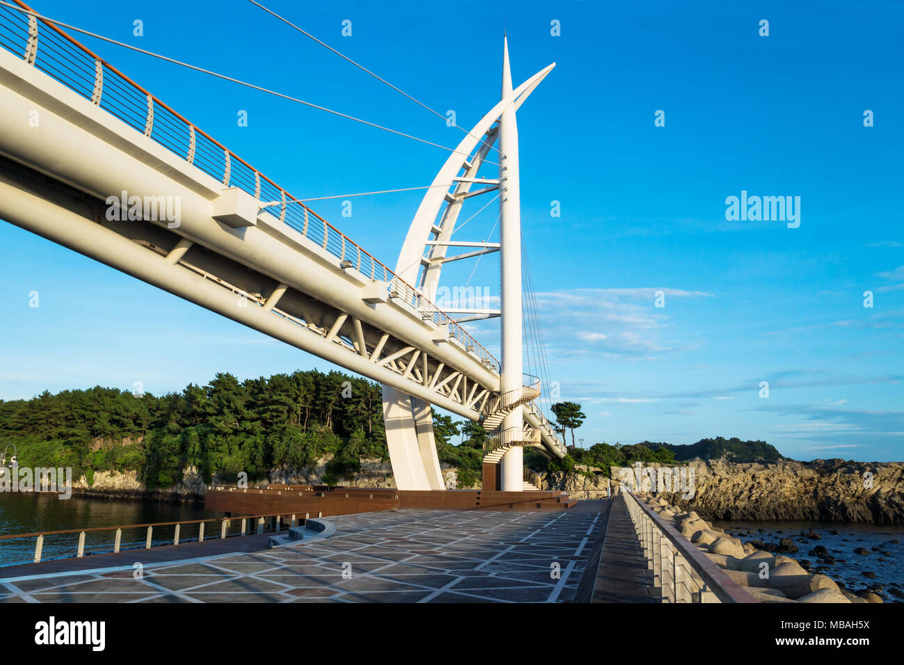 Bridge at Seogwipo linking Seaseom and Seogwipo port, Khu Du Lich Noi Tieng park, Jeju Island, South Korea Stock Photo