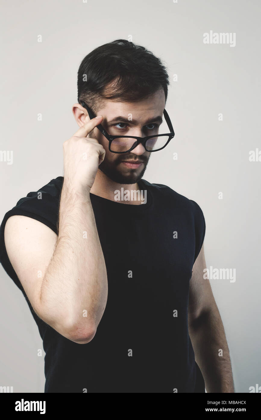 closeup. confident modern man looking over his glasses Stock Photo