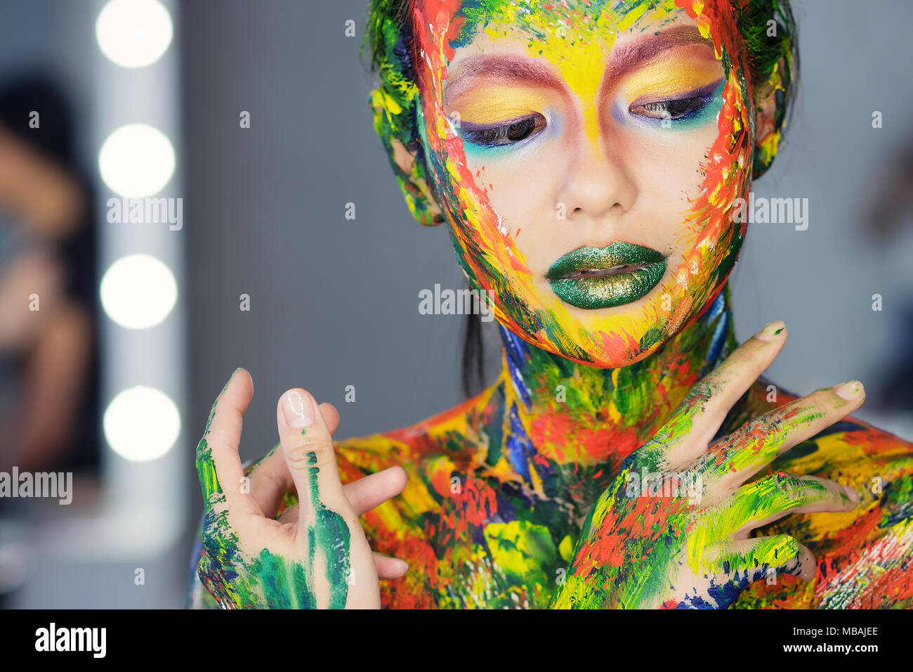 portrait of a woman completely covered with thick paint Stock Photo