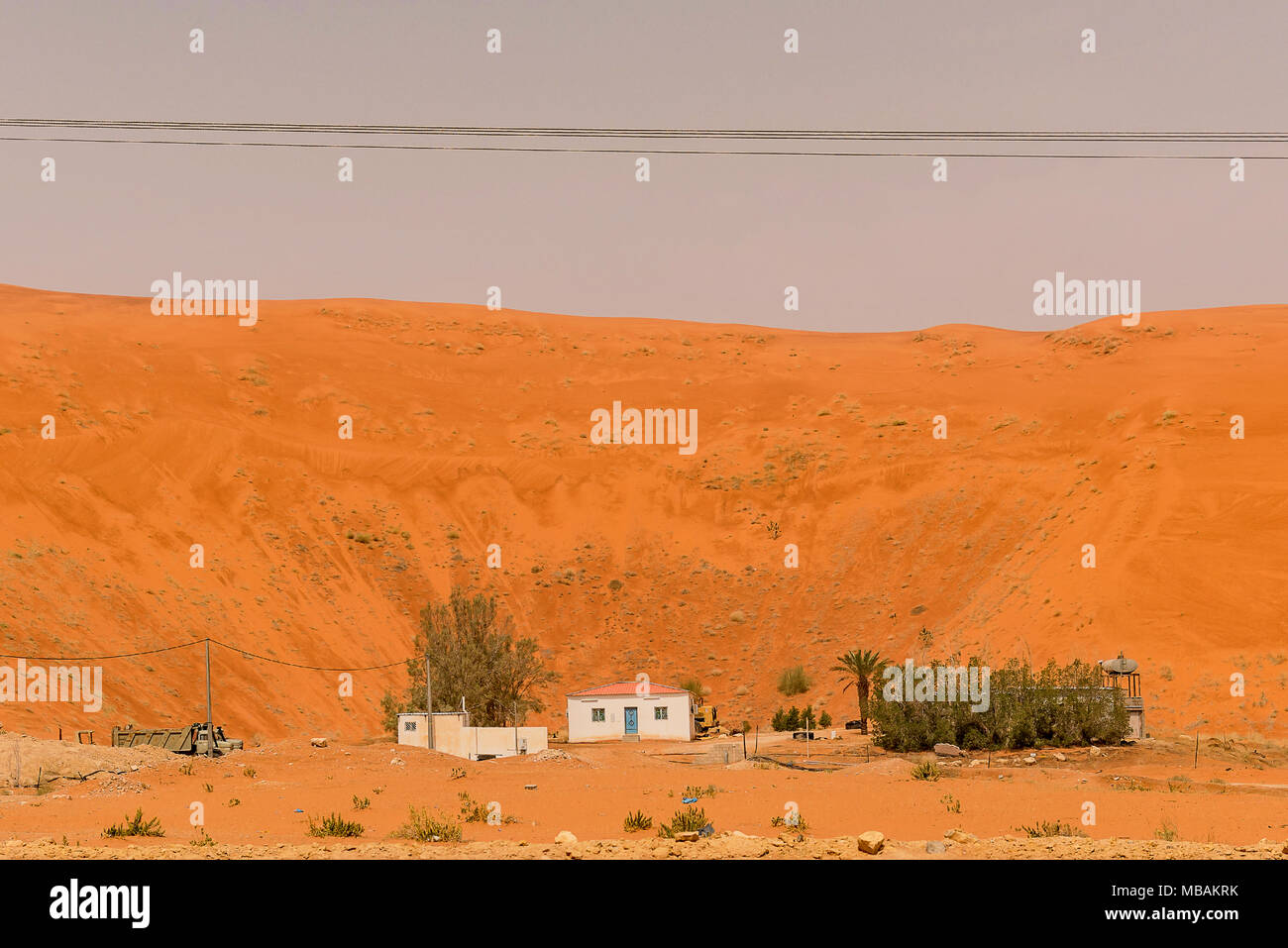A house in the pit of a sand dune near Lake Khararah Park, Saudi Arabia. Stock Photo