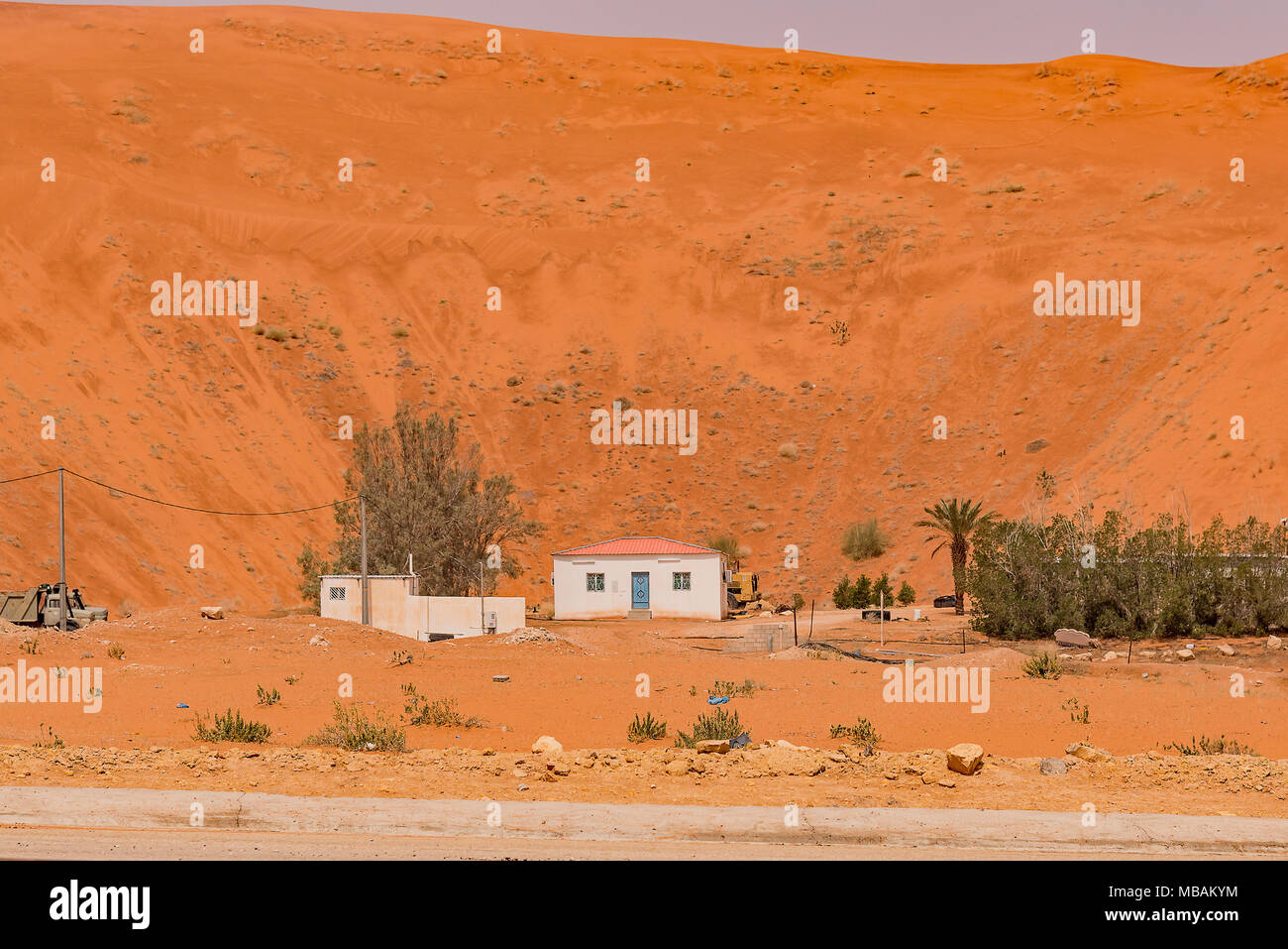A house in the pit of a sand dune near Lake Khararah Park, Saudi Arabia. Stock Photo
