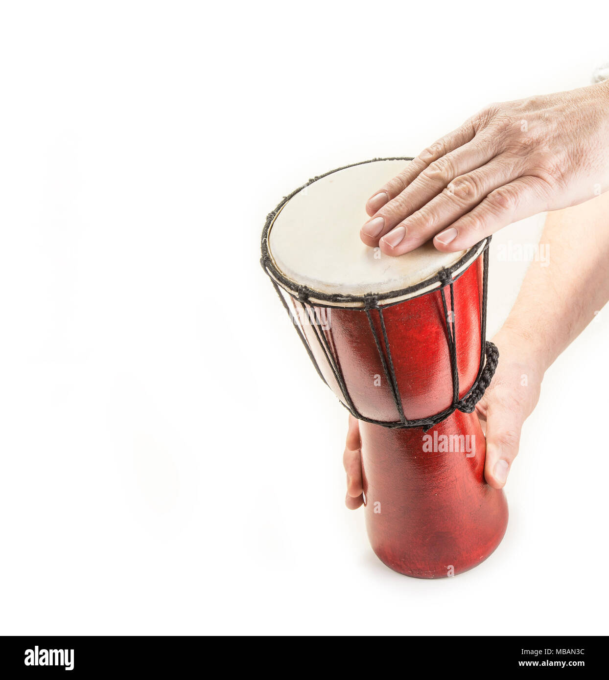 Wooden african handmade djembe drum on white Stock Photo Alamy