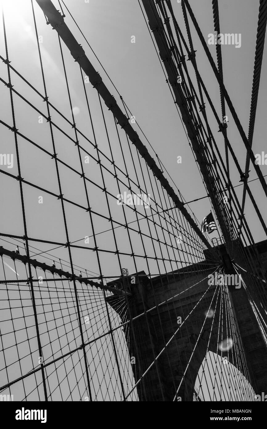 Details of the brooklyn bridge and the sun in black and white Stock Photo