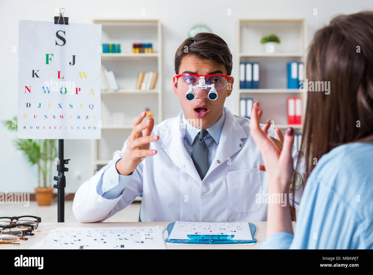 Doctor with patient at eye exam Stock Photo Alamy