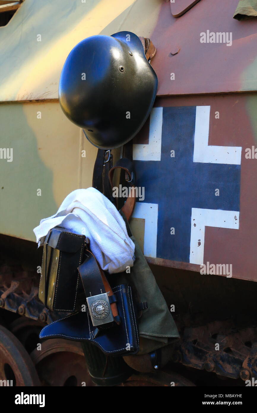 WW2 German soldier's equipment hanging from the side of an armoured tracked vehicle Stock Photo