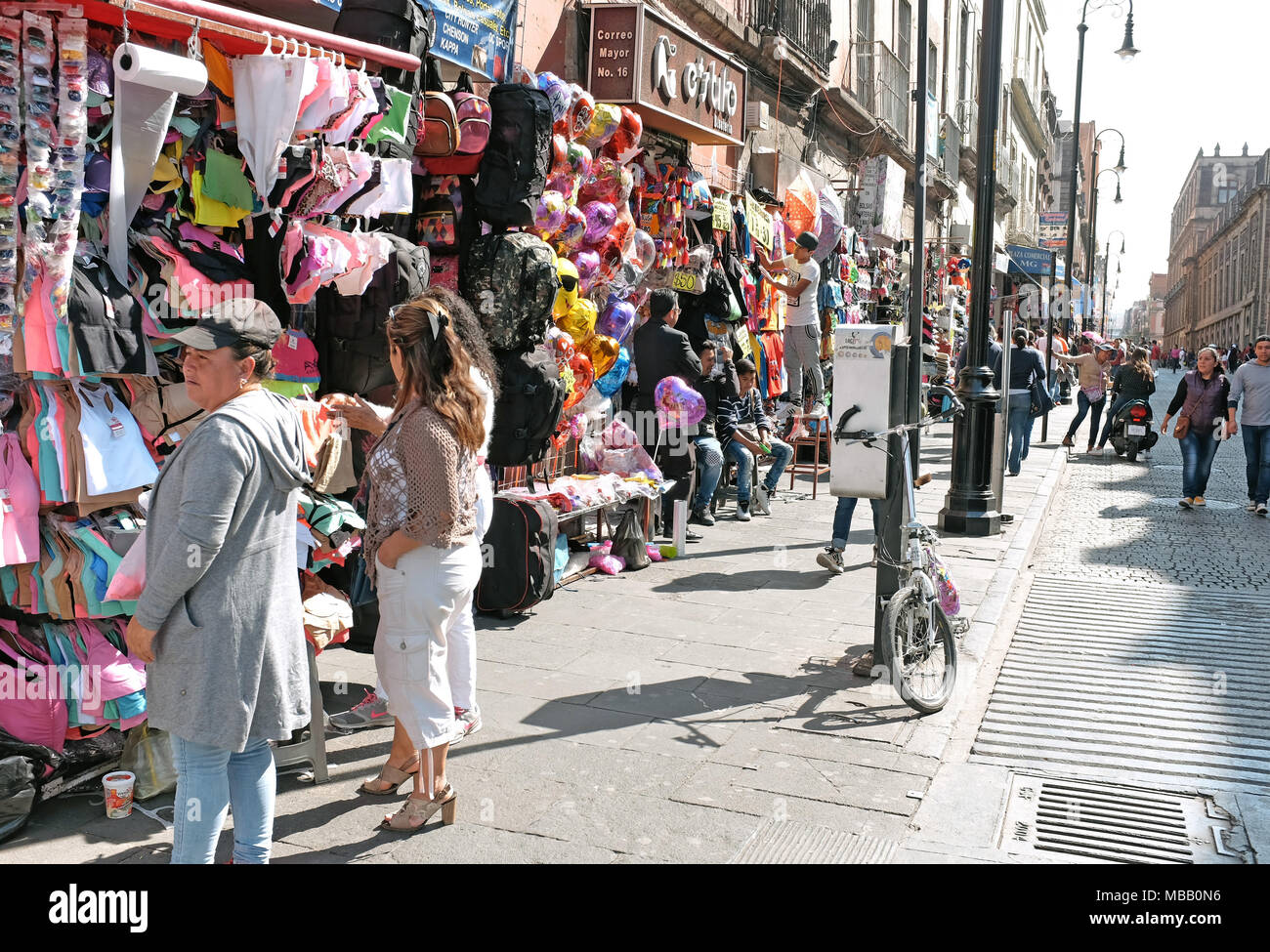 Street vendors in the historic centro neighborhood of Mexico City, Mexico, contribute to a dynamic and energetic environment Stock Photo