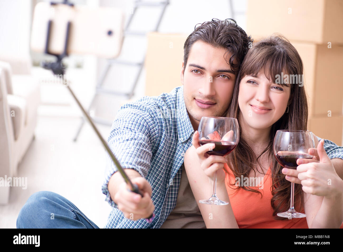 Couple taking selfie and drinking wine Stock Photo - Alamy