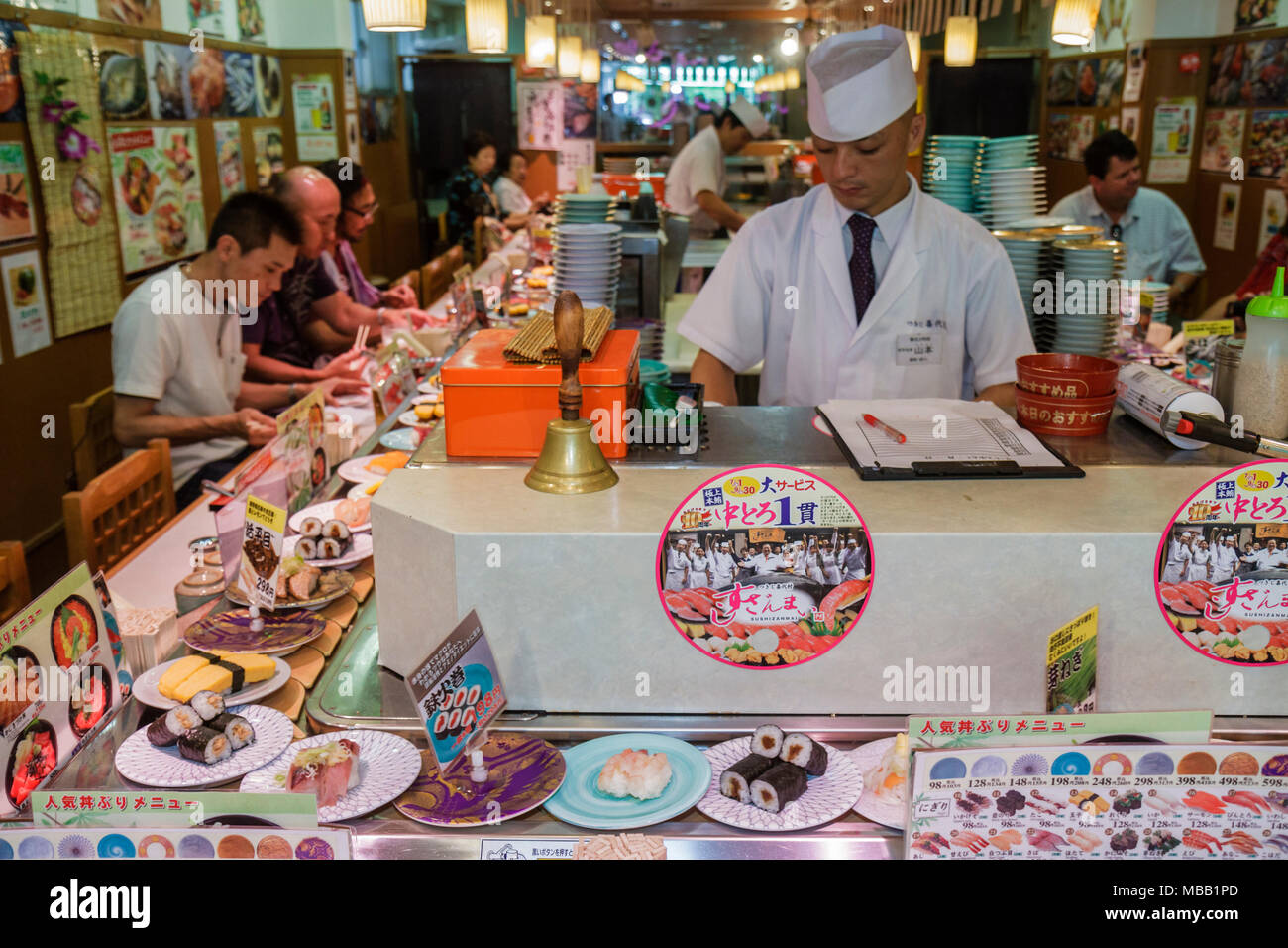 Tokyo Japan,Tsukiji Fish Market,kanji,hiragana,characters,symbols,sushi bar,restaurant restaurants food dining cafe cafes,moving,dishes,prices,custome Stock Photo