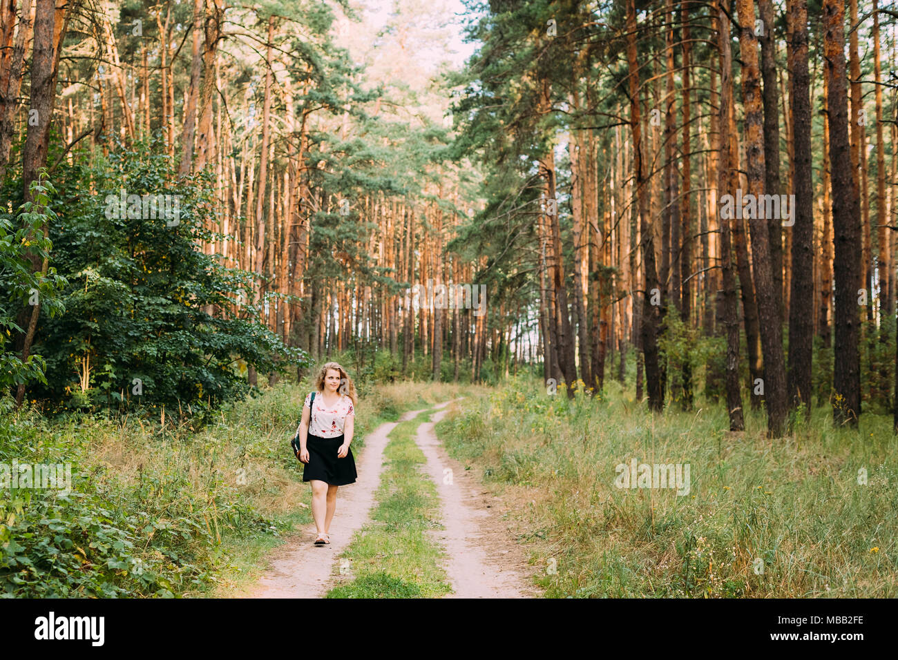 Woman in short skirt walking hi-res stock photography and images - Alamy