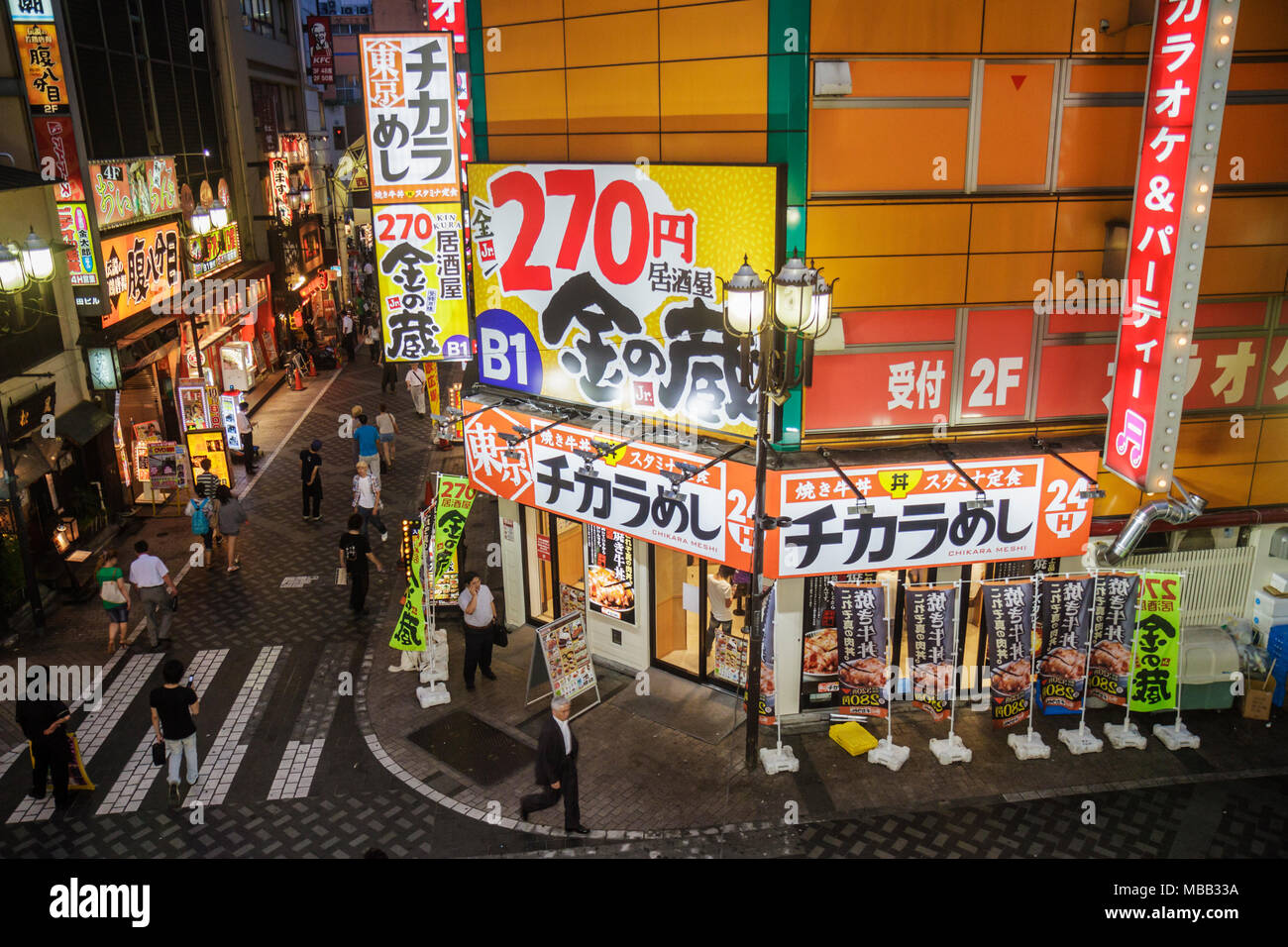 Tokyo Japan,Ikebukuro,kanji,characters,pedestrian mall,restaurant restaurants food dining cafe cafes,night evening,dusk,evening,signs,ad,advertising,a Stock Photo