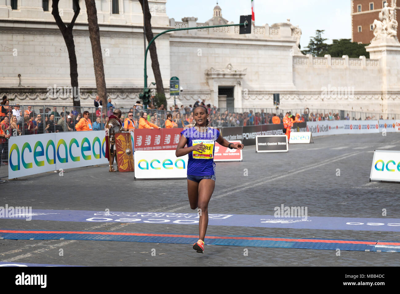 Rome, Italy - 8 April 2018: Athlete participating in the 24th edition of the Rome Marathon and Run for Fun reaches the finish line. Credit: Polifoto/Alamy Live News Stock Photo