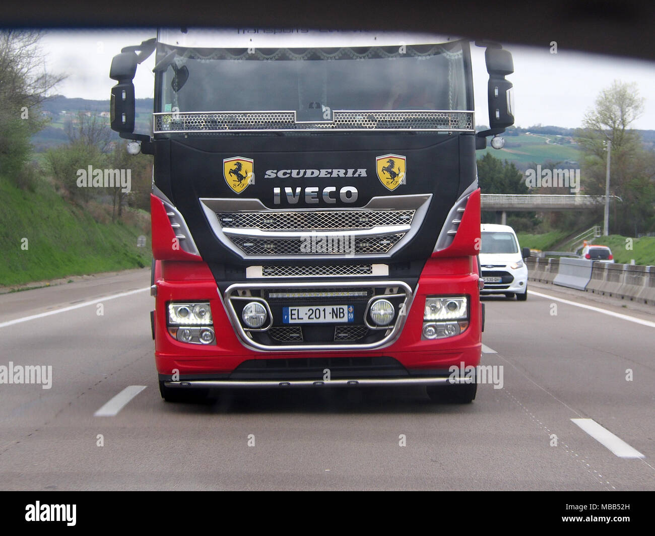 Mornas, France. 9th April, 2018. A Scuderia Ferrari truck was spotted on the A7/E35 motorway (southbound) near Mornas. Scuderia Ferrari  is the official name of the racing division of luxury Italian auto manufacturer, Ferrari, and the racing team that competes in Formula One racing.  (Pics taken from passenger side). Credit: James Bell/Alamy Live News Stock Photo