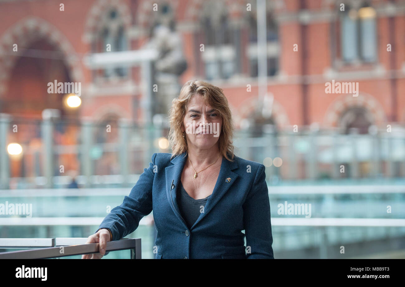 St Pancras station, London, UK. 10 April 2018. In celebration of the 150th anniversary of St Pancras International and the 250th anniversary of the RA, Tracey Emin CBE RA presents a free public Terrace Wires installation suspended from the station’s Victorian glass roof. The largest text piece she has ever made reminds travellers to stop and take a moment in one of the UK’s busiest railway stations. I Want My Time With You hangs directly below the St Pancras clock. Credit: Malcolm Park/Alamy Live News. Stock Photo