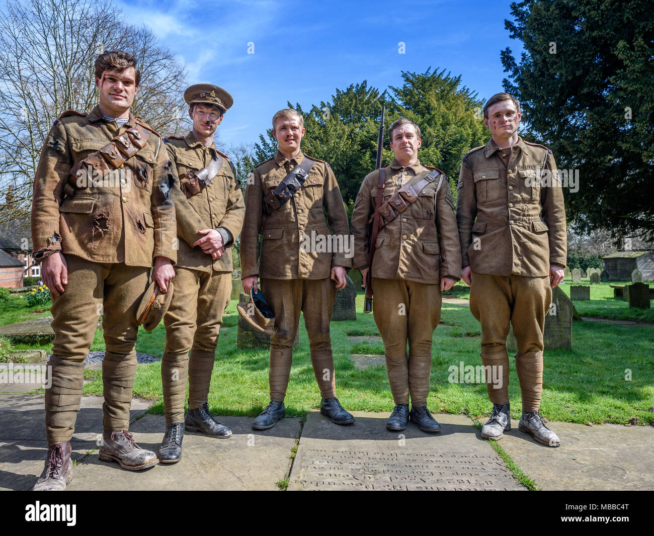 Great Budworth, UK. 9th April, 2018. extras pose dressed in Royal Artillery costumes in churchyard , starring in the new BBC drama 'War Of The Worlds' by HG Wells,filmed at Great Budworth village, Cheshire on Monday afternoon, April 9th. Credit: Ian Hubball/Alamy Live News Stock Photo