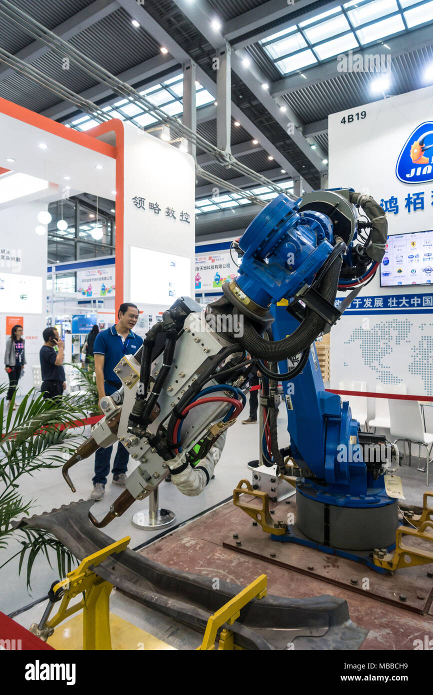 Industrial manufacturing robot exhibit at technology fair in Shenzhen, China. Stock Photo