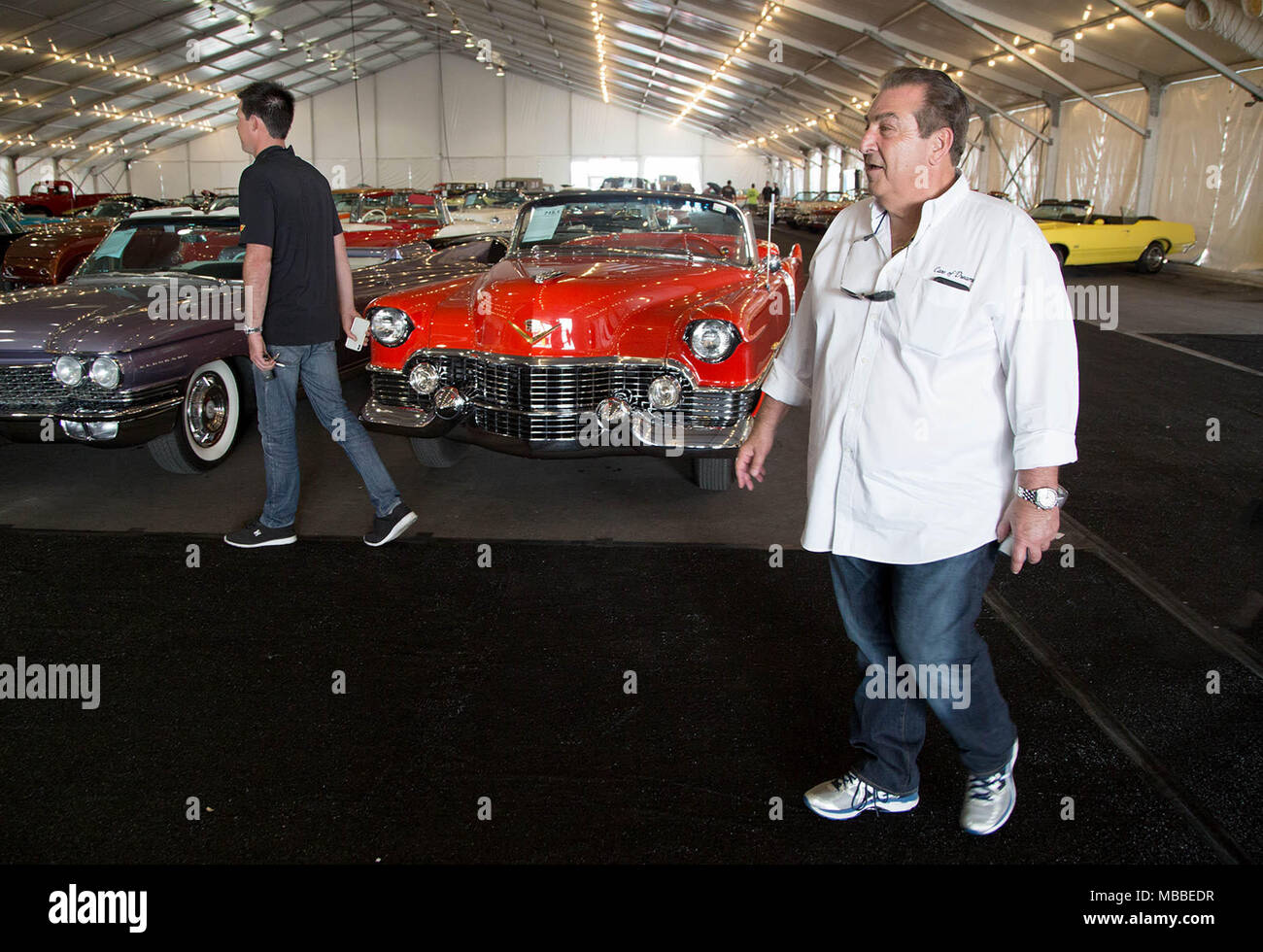 West Palm Beach, Florida, USA. 10th Apr, 2018. John Staluppi arrives at Barrett-Jackson auto auction at the South Florida Fairgrounds in West Palm Beach, Florida on April 10, 2018. Staluppi chaperoned a parade of selected cars from his Cars of Dreams Collection to the auto auction. Staluppi's collection of more than 140 cars will be sold at the 16th annual auction April 12-15. Staluppi plans to add to his current collection. Credit: Allen Eyestone/The Palm Beach Post/ZUMA Wire/Alamy Live News Stock Photo