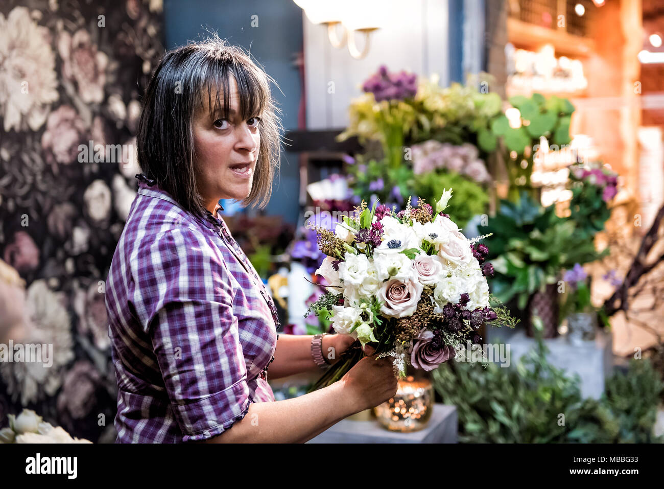 New York City, USA - October 30, 2017: Market food shop florist flowers Bastille in downtown lower Chelsea neighborhood district Manhattan NYC, one wo Stock Photo