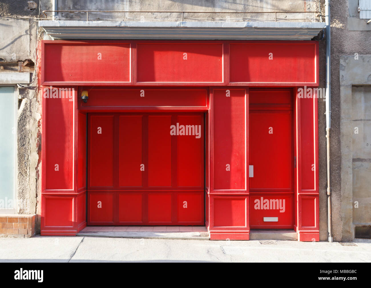 Red showcase with blank billboard in a closed store Stock Photo