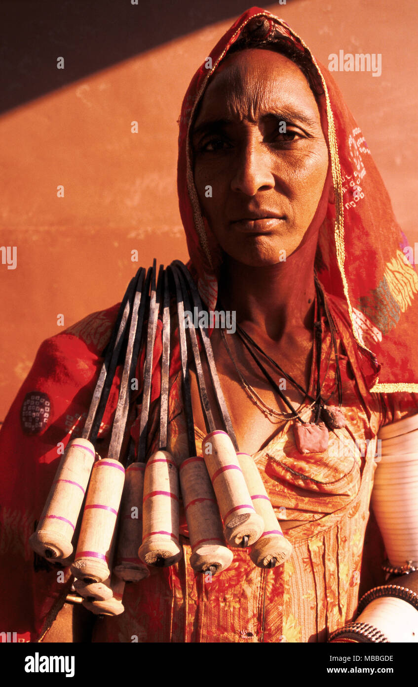 Woman selling sickles. She belongs to the Gaduliya Lohar caste ( India ...