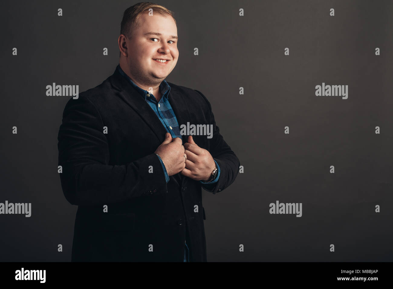 Fat man in black suit hi-res stock photography and images - Alamy