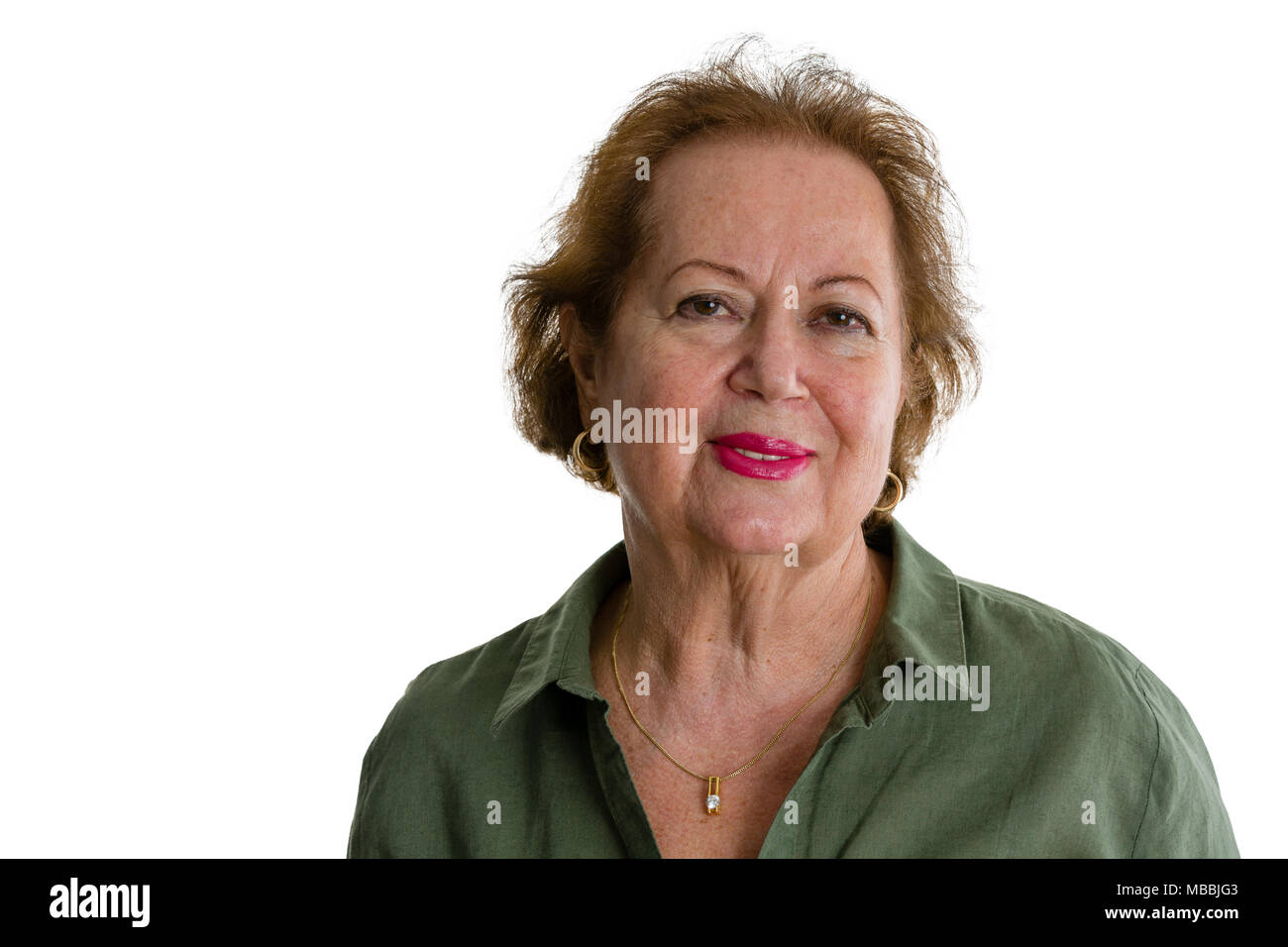 Portrait of smiling senior woman against white background Stock Photo