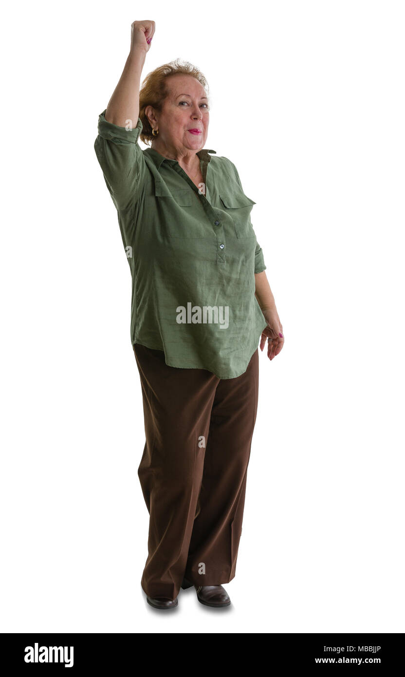 Portrait of enthusiastic senior woman raising hand while standing against white background Stock Photo