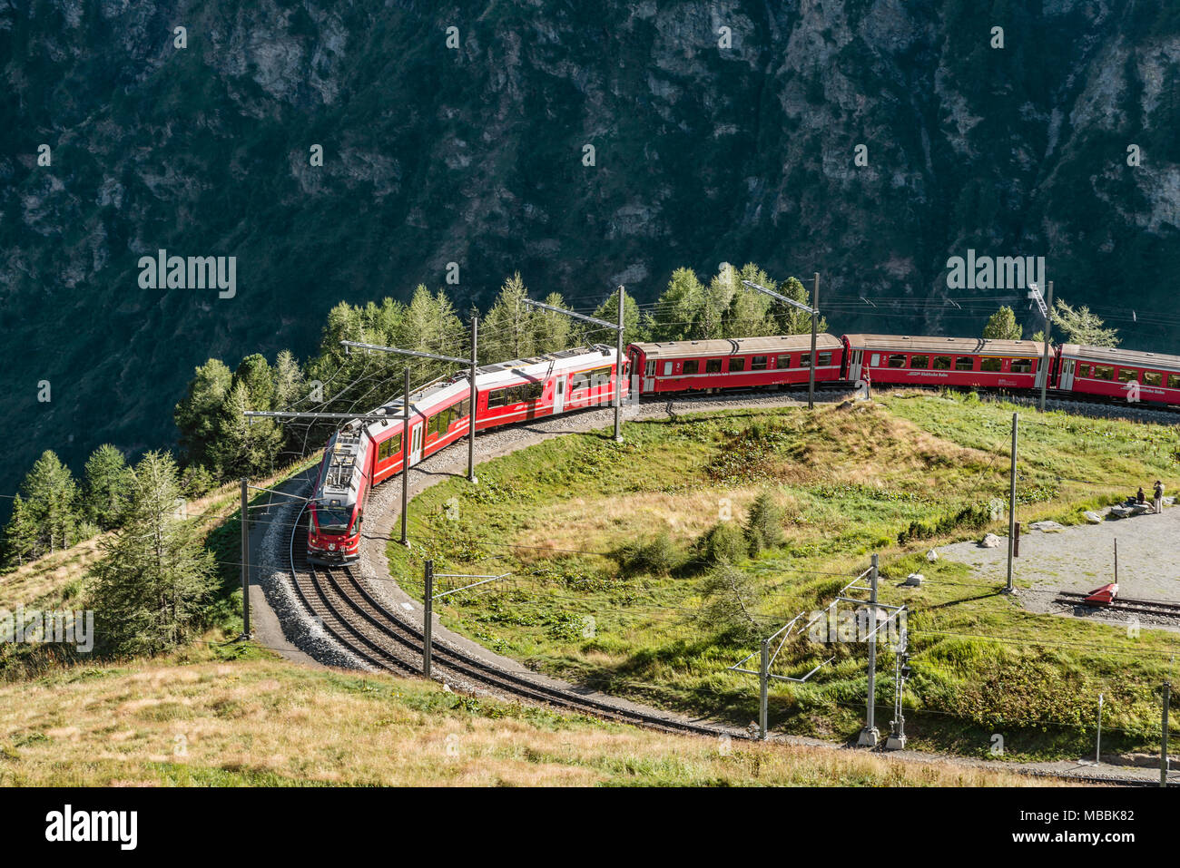 Bernina Express at Alp Gruem, with the Valposchiavo in the background, Engadin, Switzerland Stock Photo