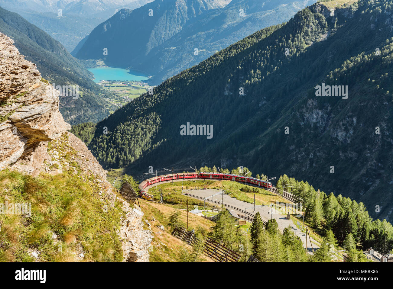 Mountain train at Alp Gruem train station, with the Valposchiavo in the background, Engadin, Switzerland Stock Photo