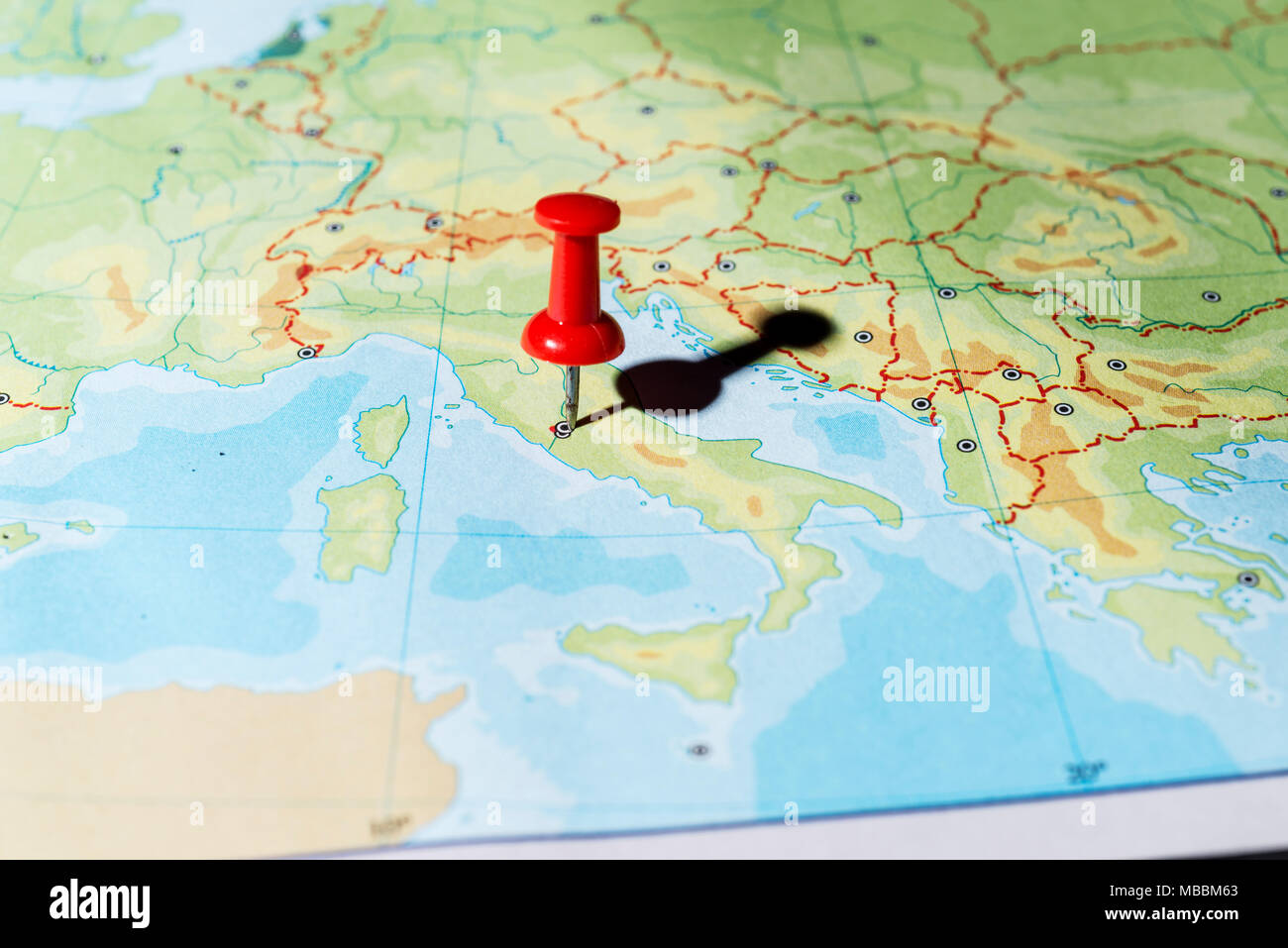 Red pin on a map pointing Rome Stock Photo