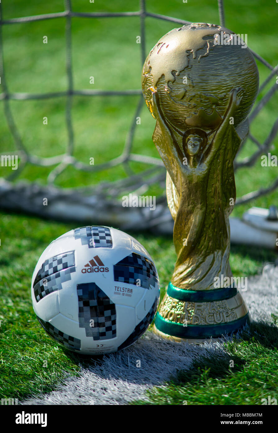 April 9 2018 Moscow Russia Trophy of the FIFA World Cup and official ball of FIFA World Cup 2018 Adidas Telstar 18 on the green grass of the footbal Stock Photo Alamy