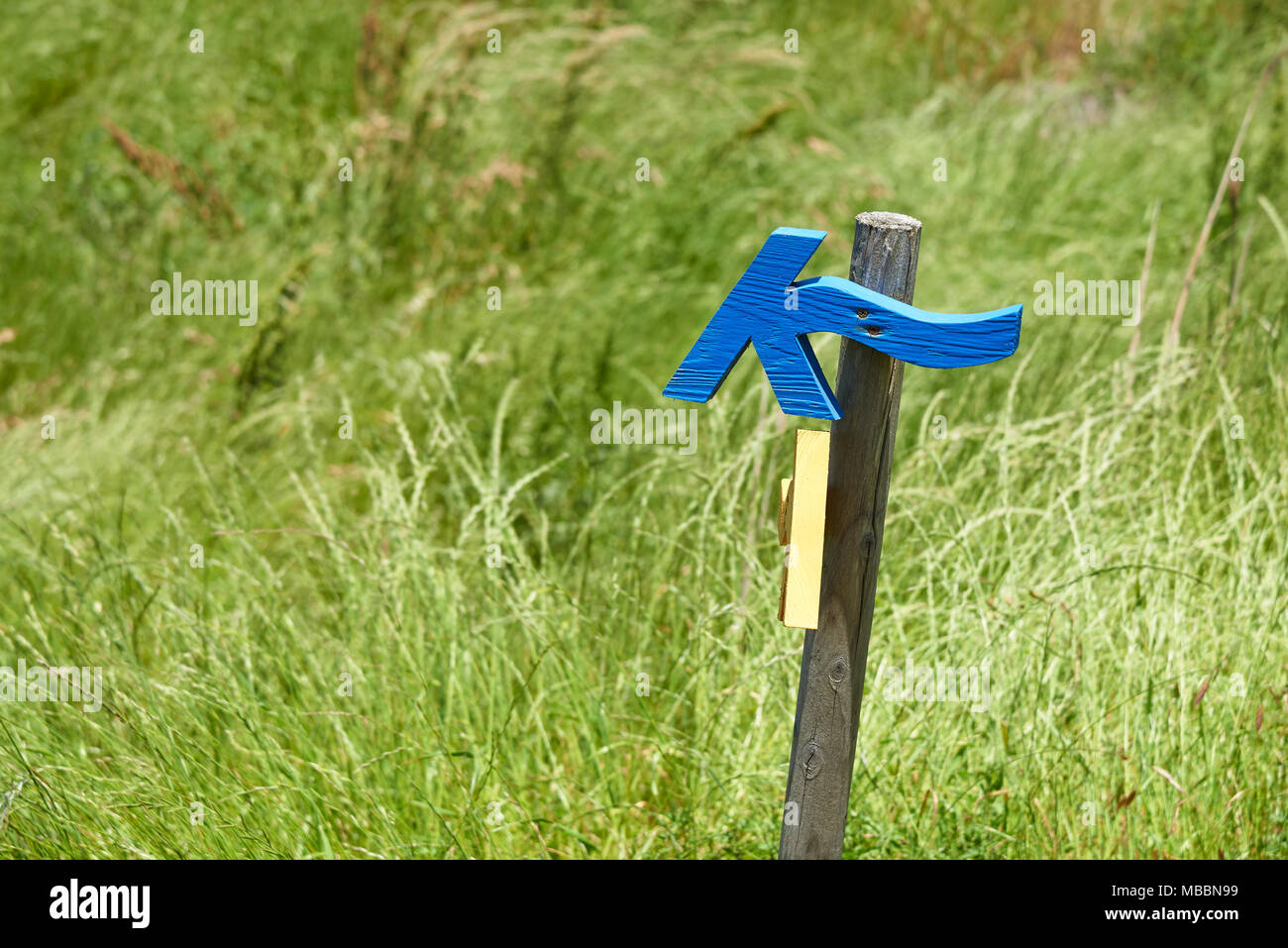 Jeju, Korea - May 26, 2017: Jeju Olle trail direction sign. The trail is a famous long-distance foot path on Jeju island. The routes are mostly follow Stock Photo