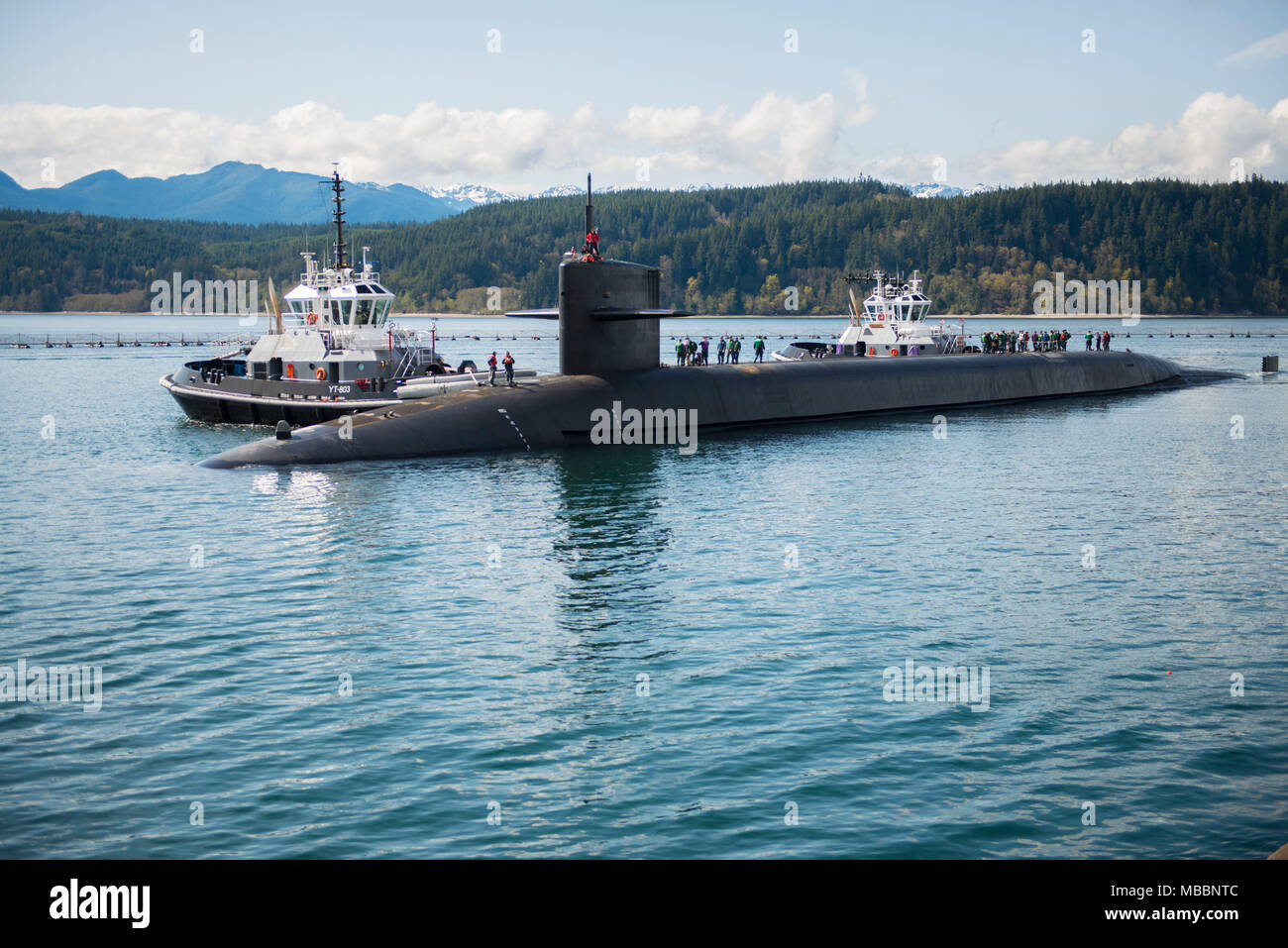 PUGET SOUND, Wash. (April 4, 2018) The Ohio-class ballistic missile submarine USS Henry M. Jackson (SSBN 730) arrives to its homeport at Naval Base Kitsap-Bangor following a strategic deterrent patrol. Henry M. Jackson is one of eight ballistic missile submarines stationed onboard Naval Base Kitsap-Bangor providing the most survivable leg of the strategic deterrence triad for the United States. (U.S. Navy photo by Lt. Cmdr. Michael Smith/Released) Stock Photo