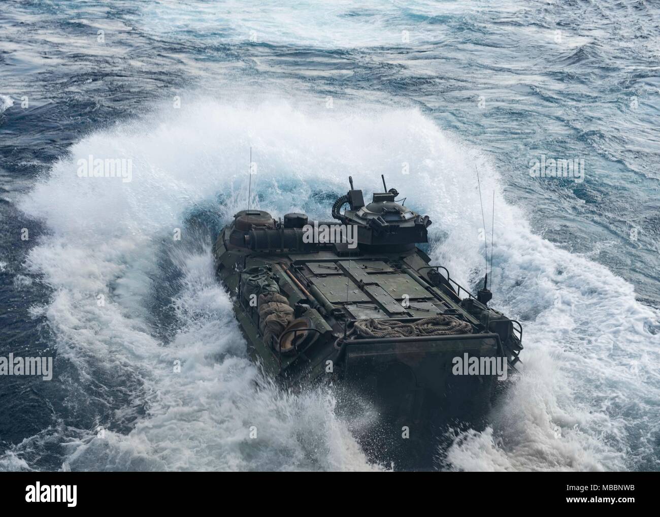 180402-N-TJ319-0195 U.S. 5TH FLEET AREA OF OPERATIONS (April 2, 2018) An AAV-P7/A1 assault amphibious vehicle, attached to the 26th Marine Expeditionary Unit, disembarks the well deck of the Harpers Ferry-class dock landing ship USS Oak Hill (LSD 51) April 2, 2018, in preparation to begin Alligator Dagger. Led by Naval Amphibious Force, Task Force 51/5th Marine Expeditionary Brigade, Alligator Dagger integrates U.S. Navy and Marine Corps assets to practice and rehearse a range of critical combat-related capabilities available to U.S. Central Command both afloat and ashore to promote stability  Stock Photo