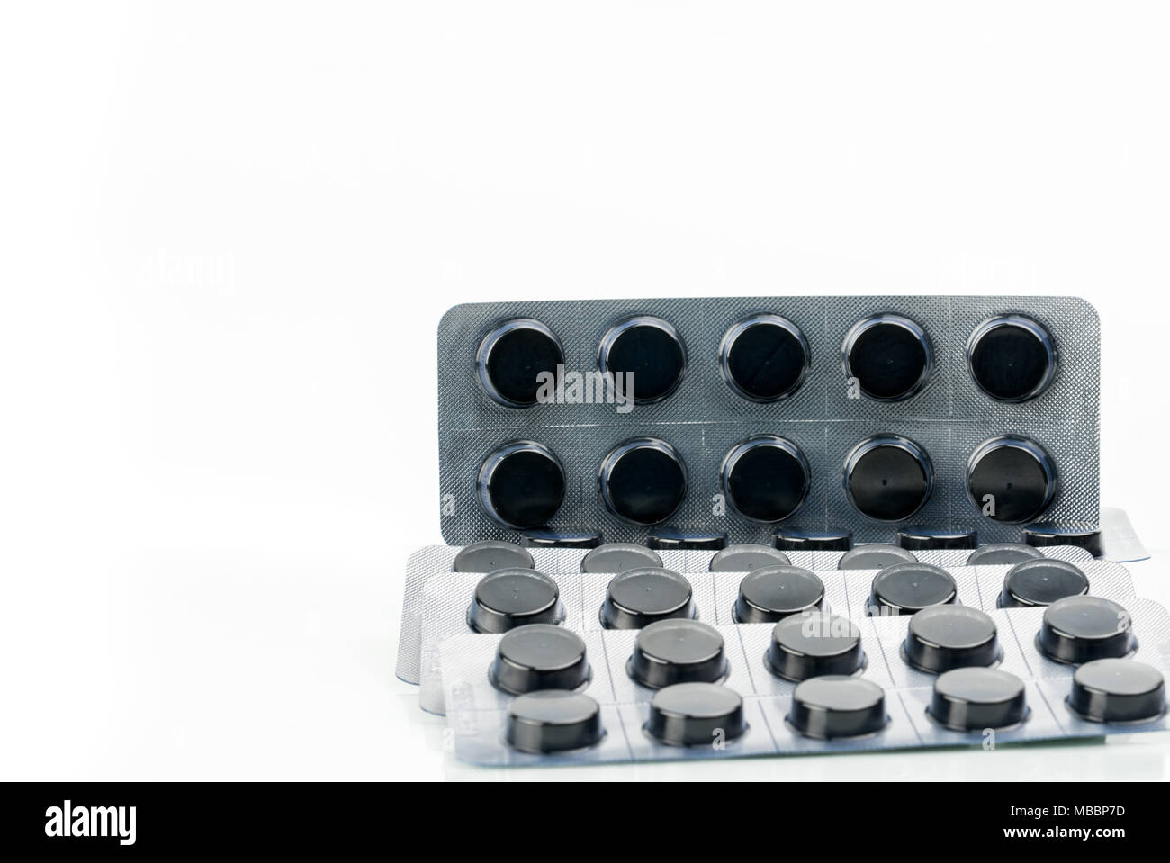 Activated charcoal tablets pills in blister pack isolated on white