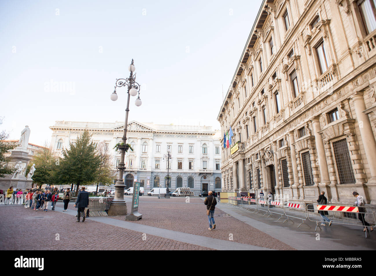 Milan, Italy - October 24, 2017: La Scala square with Monument to Leonardo da Vinci, City Hall (Palazzo Marino) and Gallerie d'Italia. Stock Photo