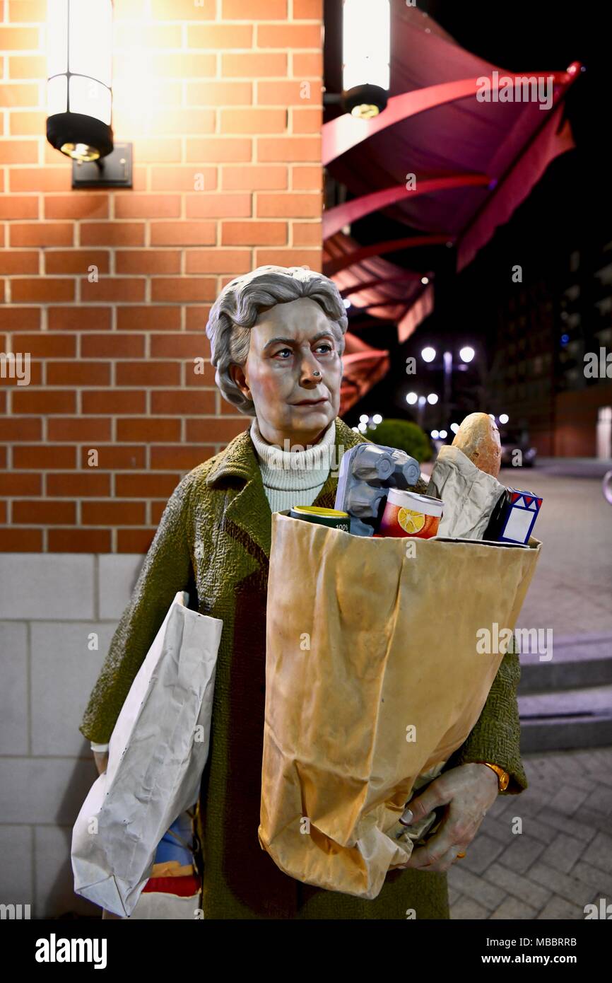 The bag lady carrying groceries statue at the National harbor in