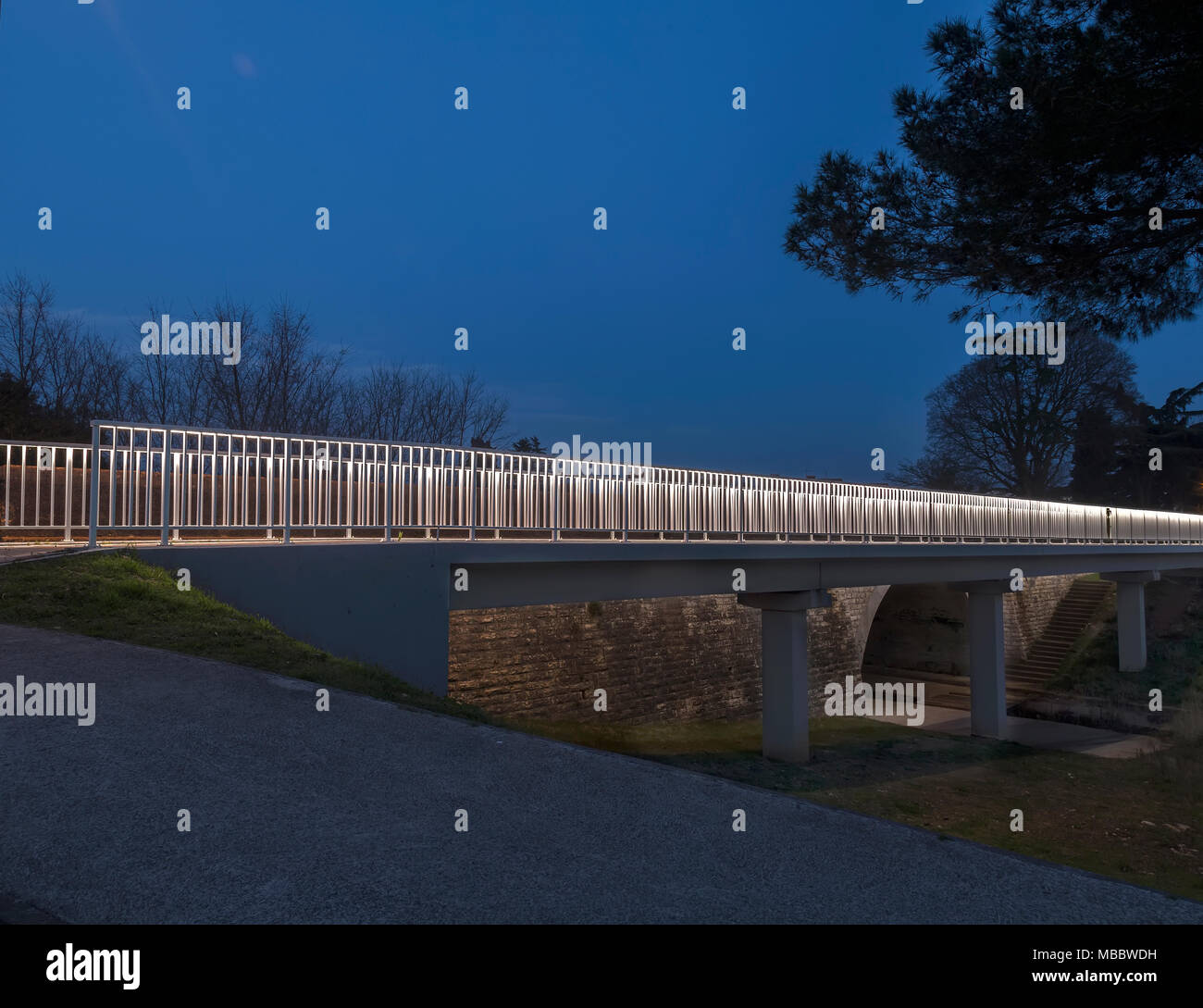 illuminated pedestrian bridge in Valbandon, Pula, Croatia Stock Photo