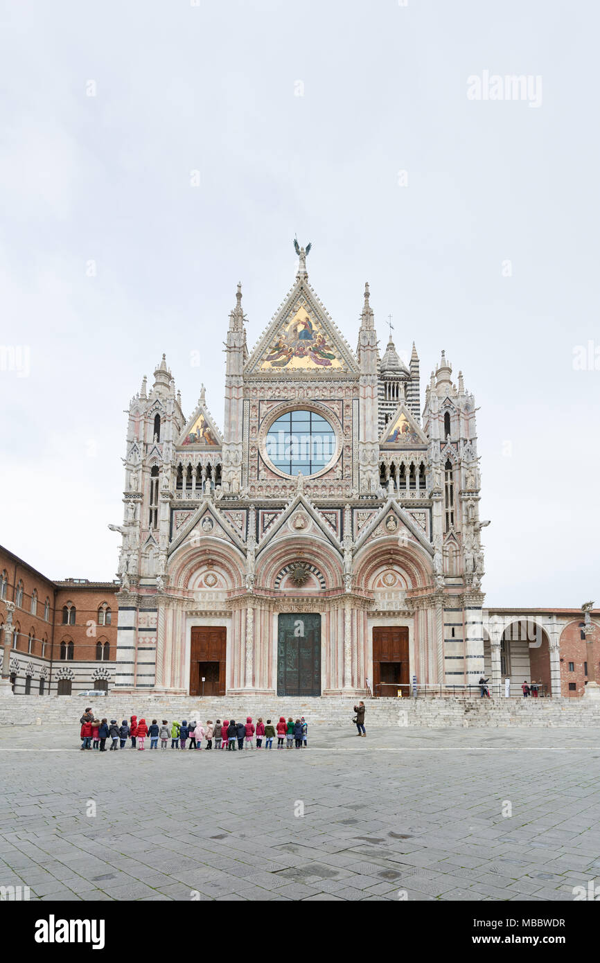 Siena, Italy - Febuary 16, 2016: Siena Cathedral, a medieval church built in the Romanesque and Italian Gothic style, between 1215 and 1263. It is fam Stock Photo