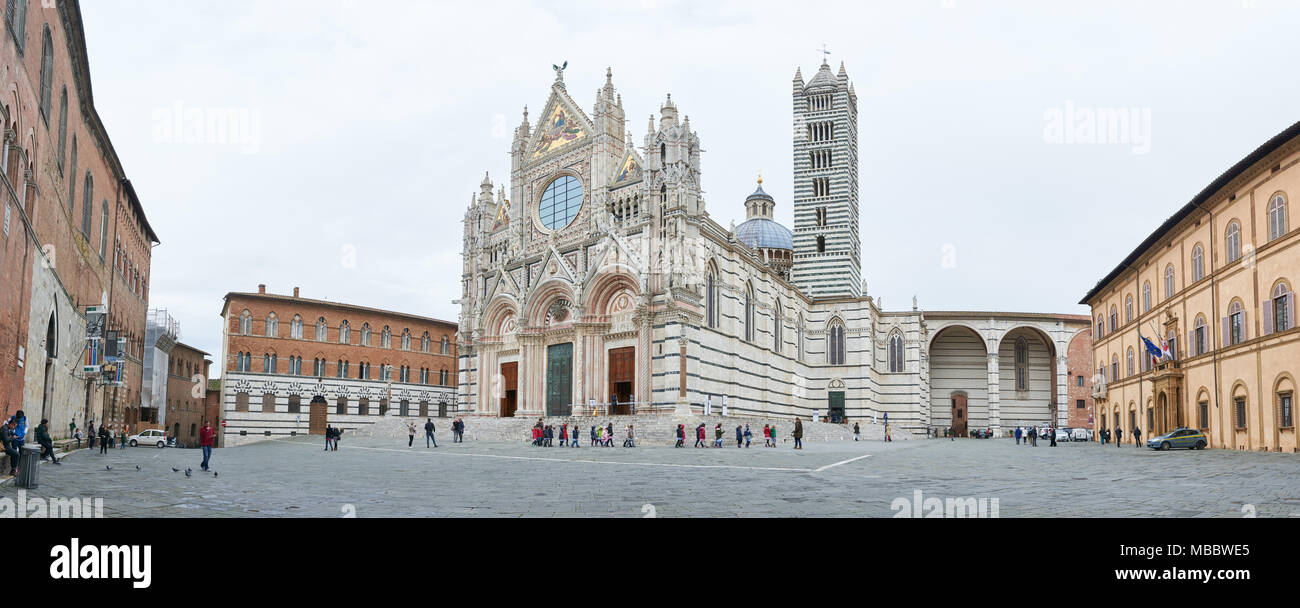 Siena, Italy - Febuary 16, 2016: Siena Cathedral, a medieval church built in the Romanesque and Italian Gothic style, between 1215 and 1263. It is fam Stock Photo