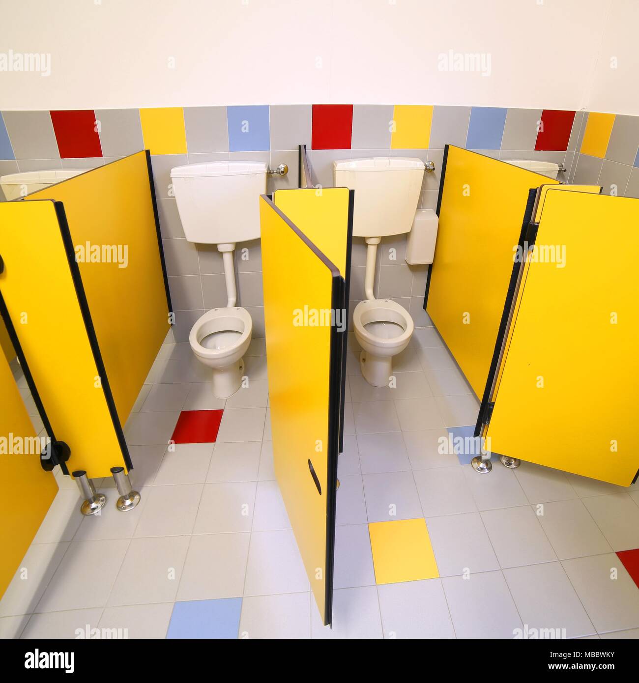 little toilets in the bathroom of a kindergarten without people Stock