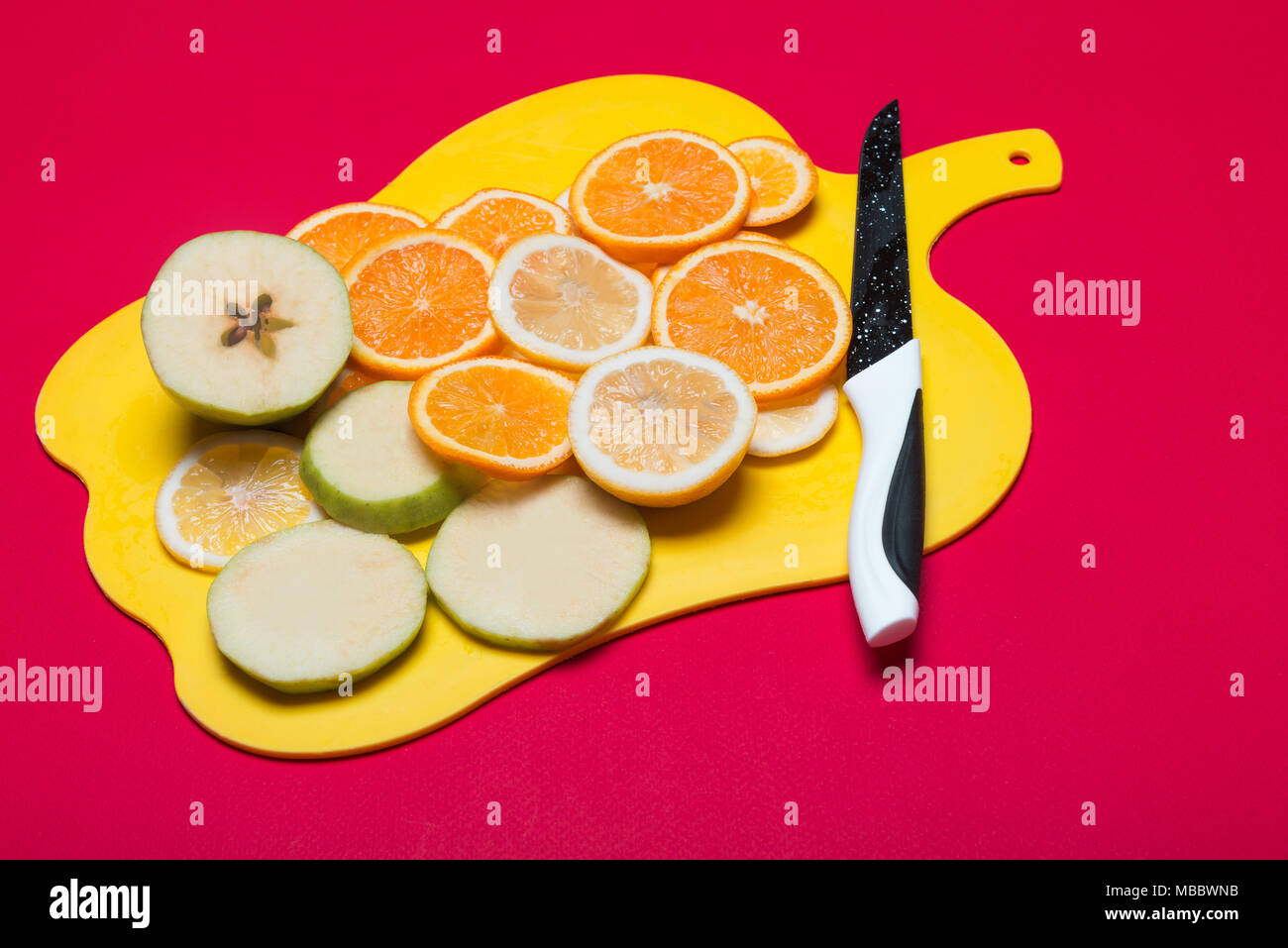 Fruit lying on a cutting board Stock Photo