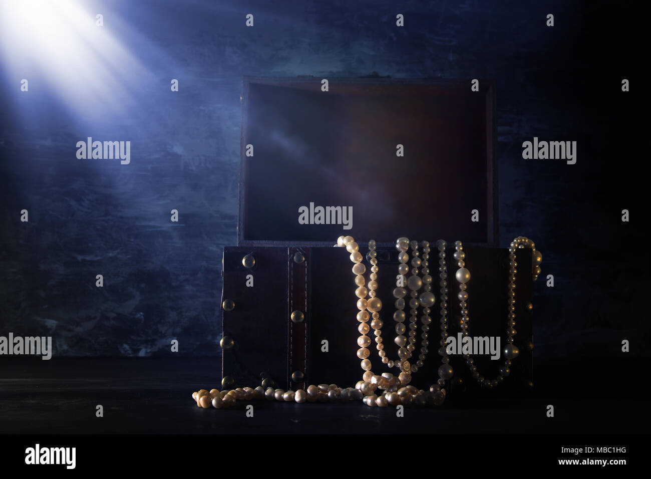 Image of mysterious opened old wooden treasure chest with light. An ...
