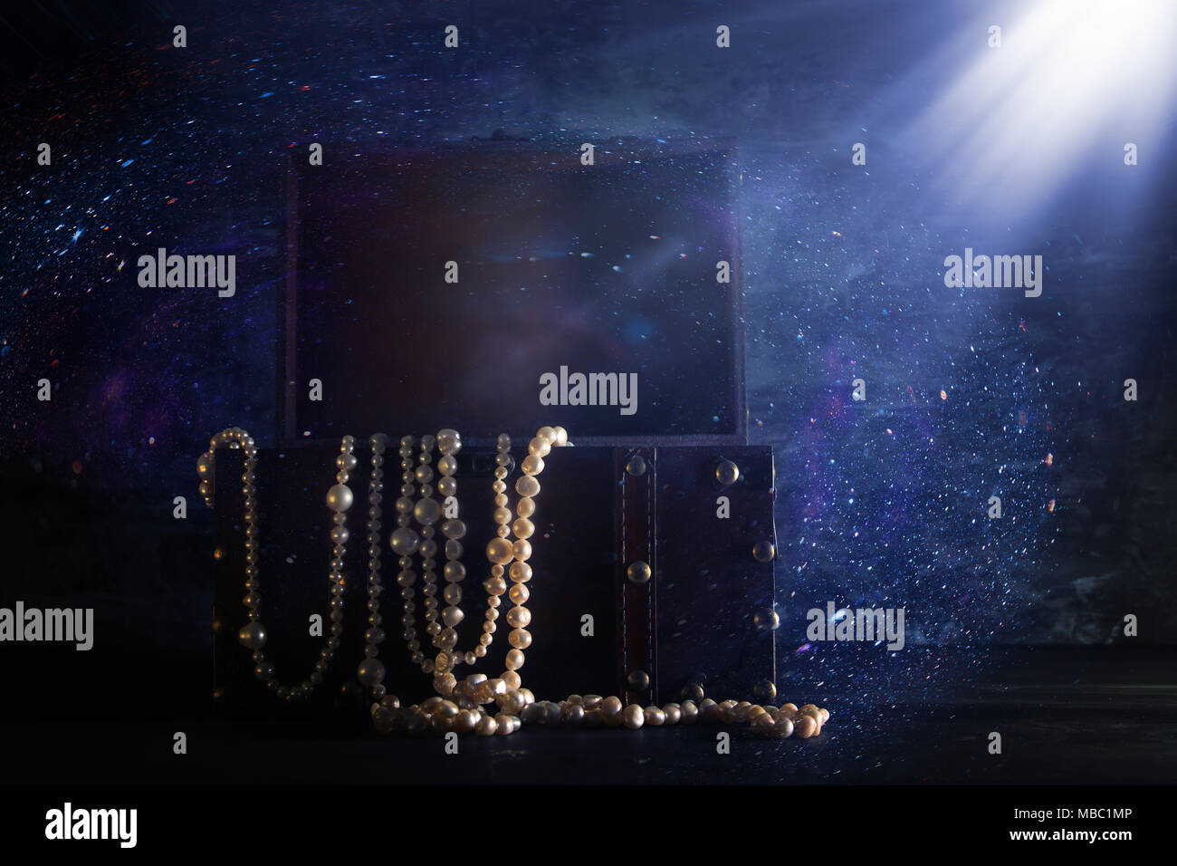Image of mysterious opened old wooden treasure chest with light. An ...