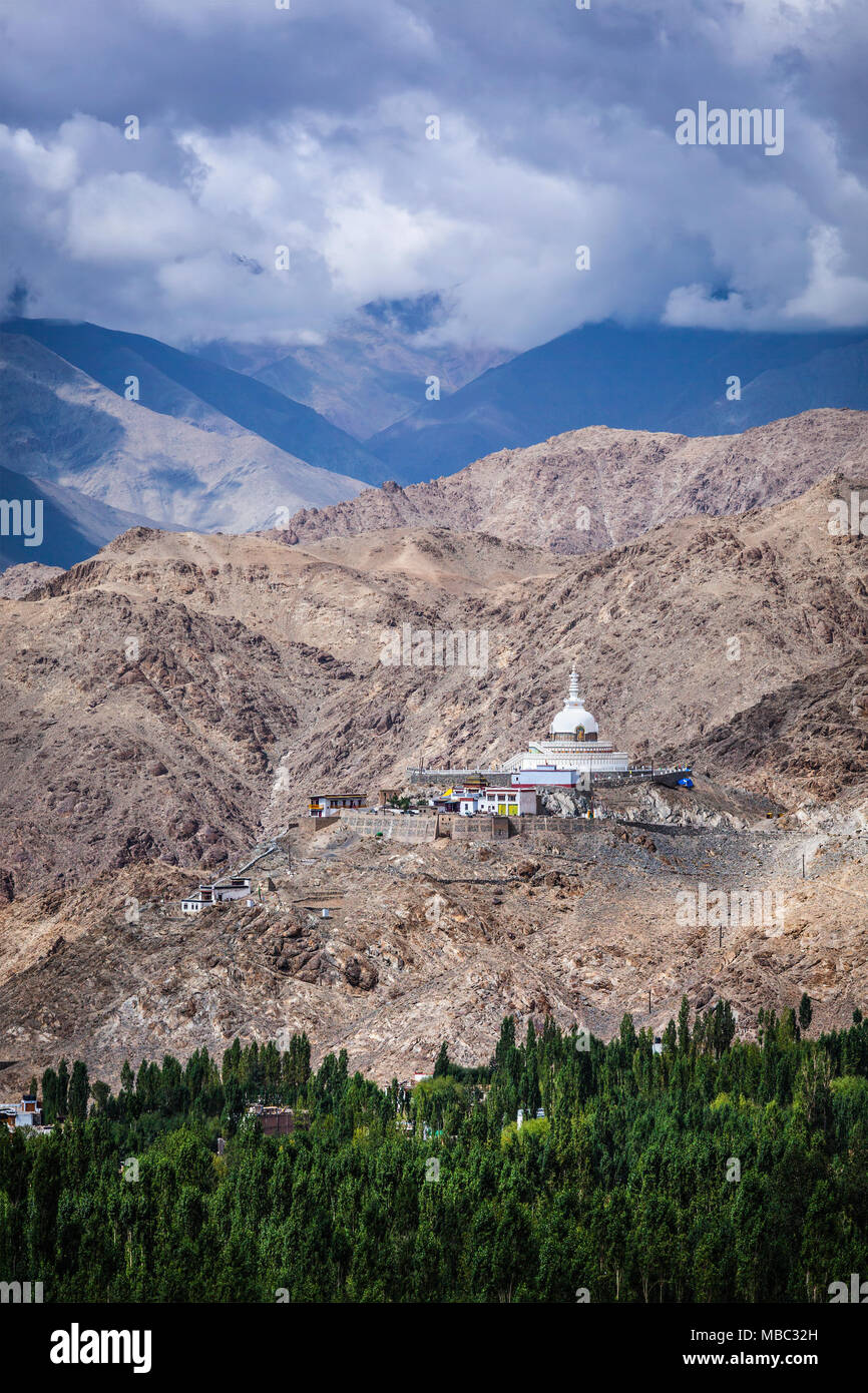 Buddhist stupa (chorten) on a hilltop in Himalayas Stock Photo