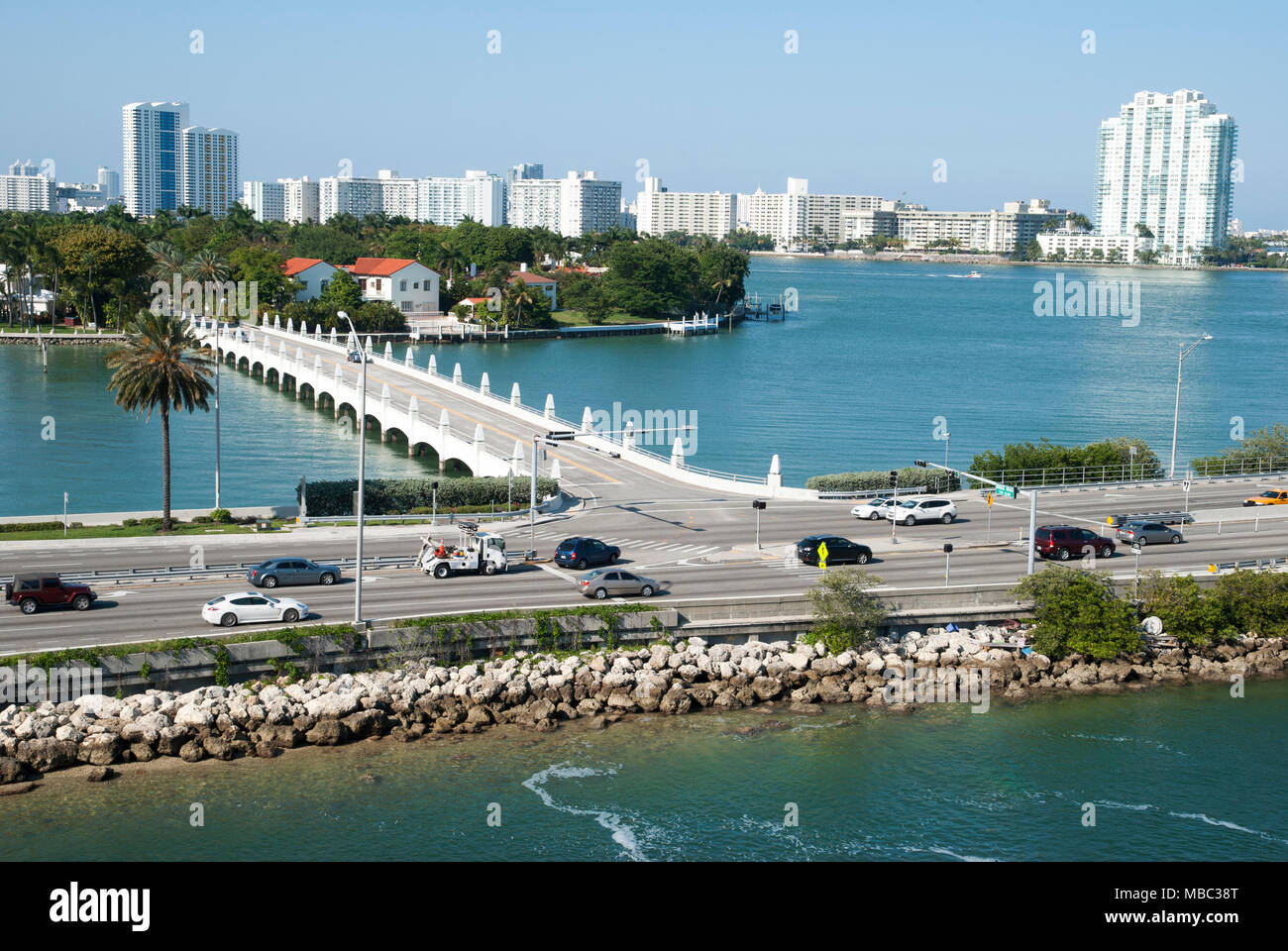 The view of Miami city MacArthur Causeway passing by the bridge - entrance to Palm island (Florida). Stock Photo