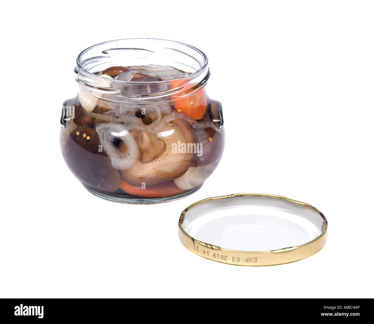 Shiitake marinated mushrooms in jar isolated on white background Stock